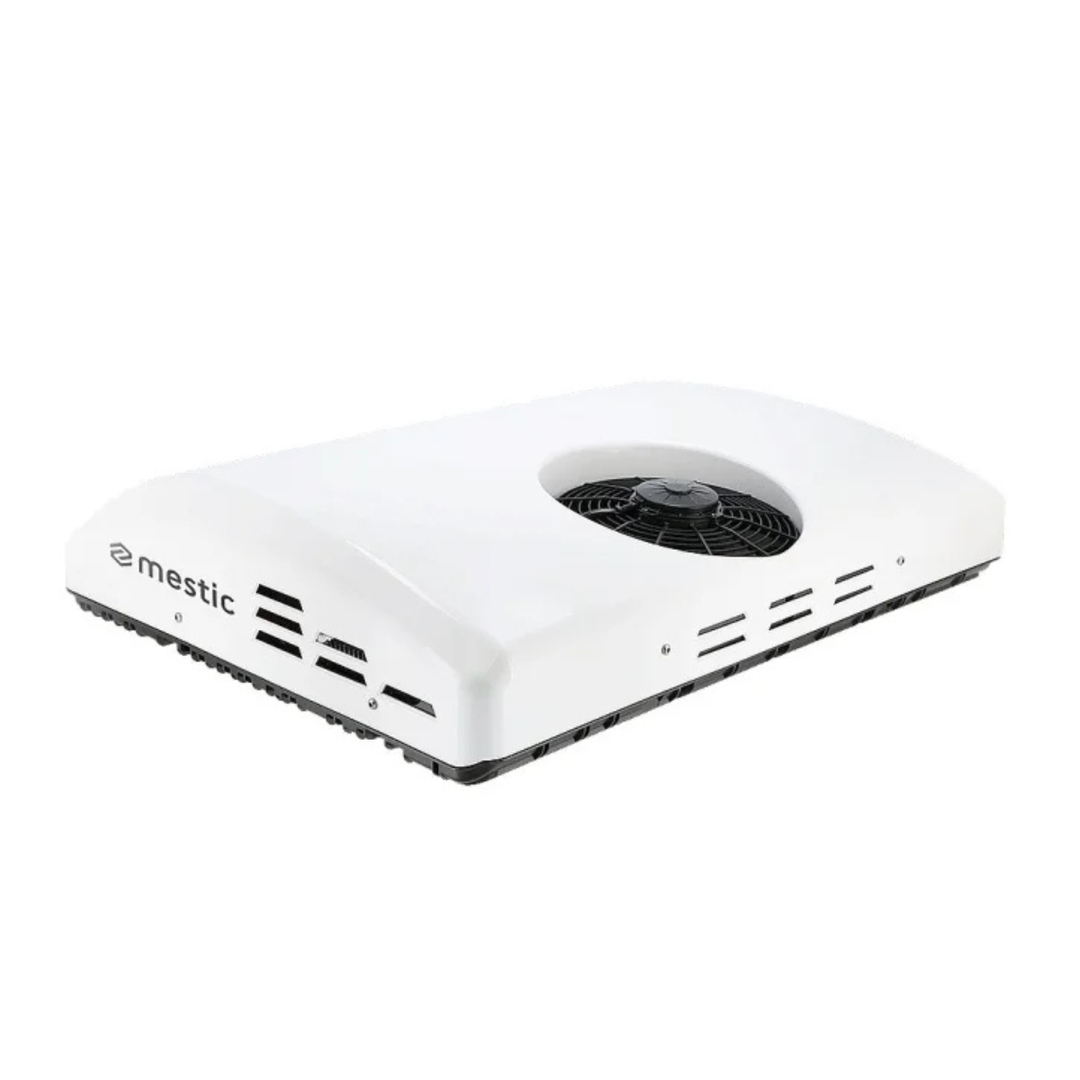 Mestic RTA-2000 12V rooftop air conditioner with white aerodynamic housing, side ventilation slots, and exposed top cooling fan on a white background.