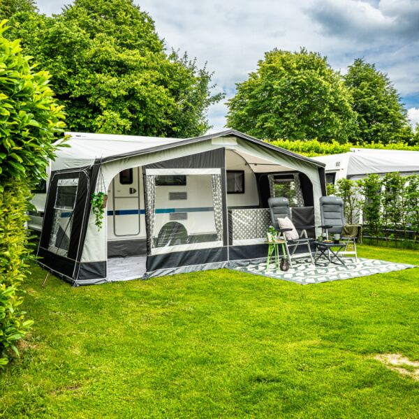 Monza 240 Caravan Awning shown from front left in a field