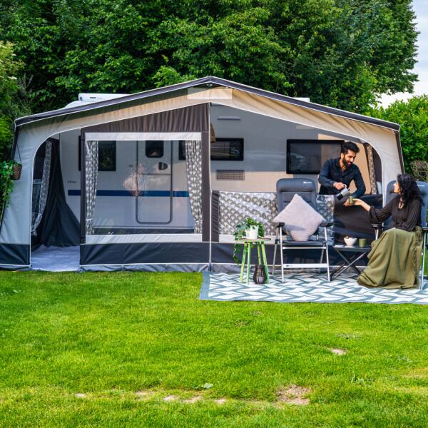 Monza XL 300 Awning shown from the front with a couple using it