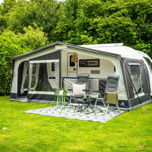 Monza XL 300 Caravan Awning shown from the front right in a field