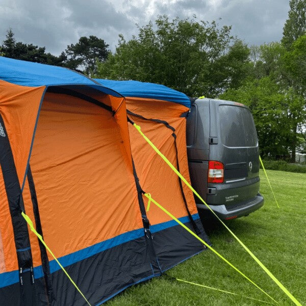 Olpro Loopo Breeze in orange connected to a motorhome