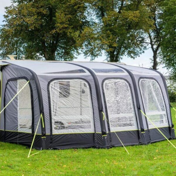 Olpro View Porch awning in a field in front of trees