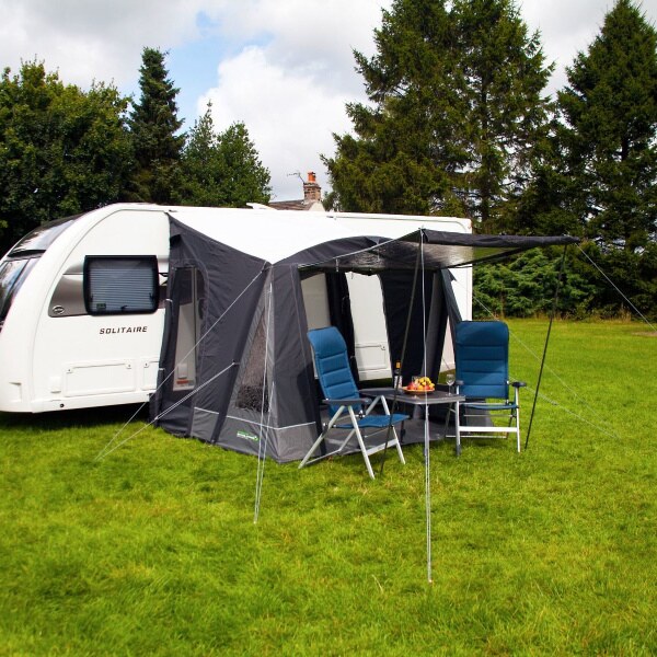 Outdoor Revolution Porch Pro 260 Air Awning with a front canopy and blue chairs