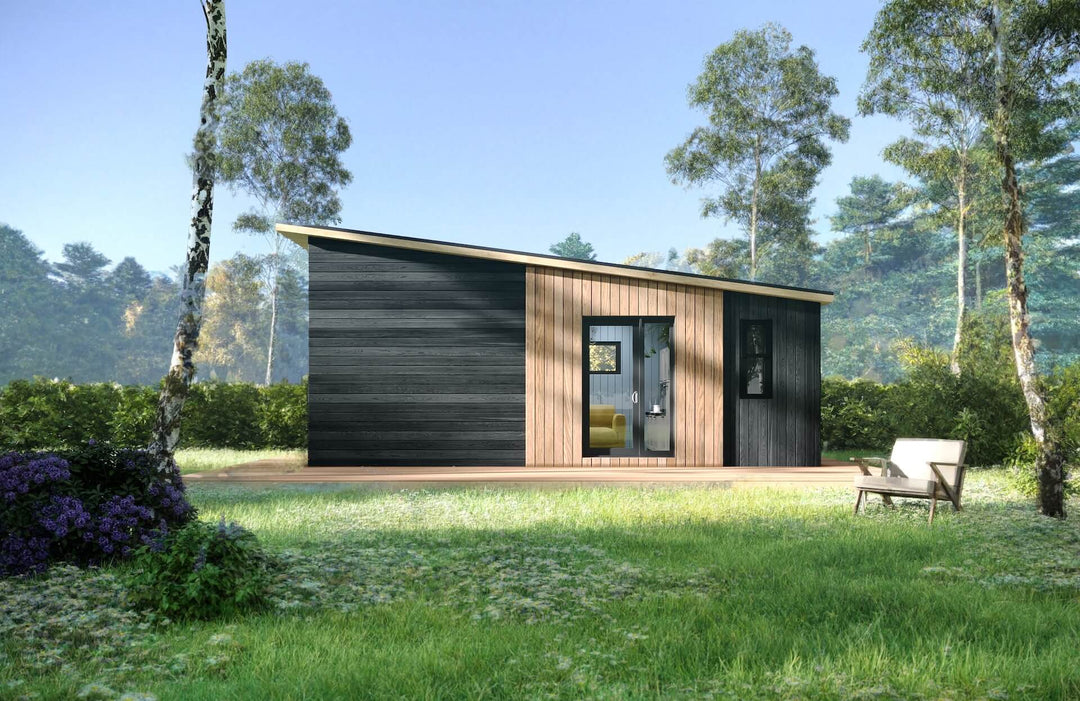 Front-facing view of a contemporary glamping pod with vertical timber slats and black cladding, surrounded by trees and greenery.