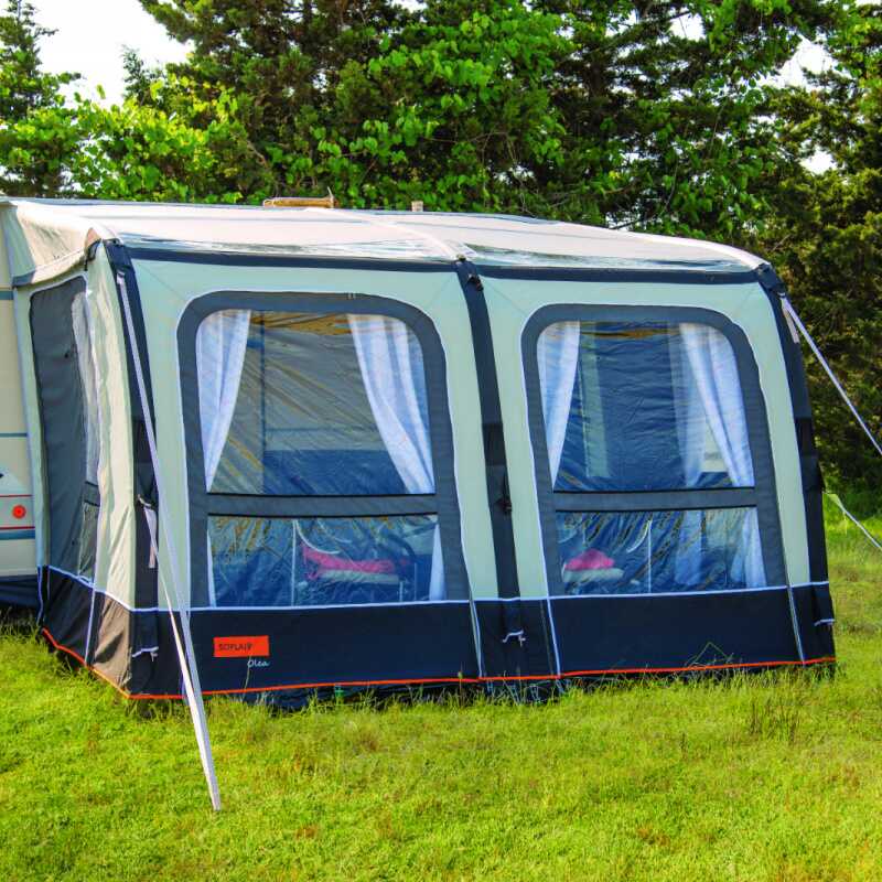 A Soplair Olea Air Inflatable Caravan Awning in a field