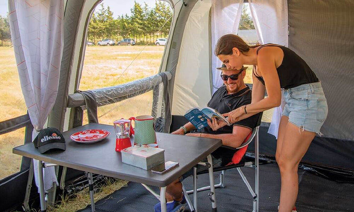 A couple inside a Soplair Olea Air Awning