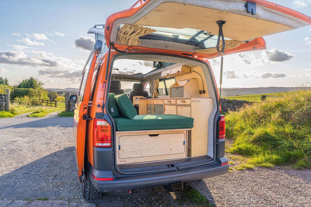 Campervan Squall Kitchen Unit camper layout with slide out stove and worktop space inside van, parked outdoors.