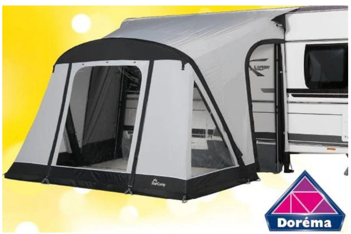 Starcamp Quick N Easy Air 225 awning connected to a caravan with a yellow background and logo saying "Dorema" in the bottom right corner