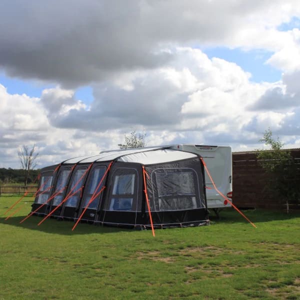 Camptech Starline Elite Infinity Pod in grey and black with multiple panels on a grassy background.