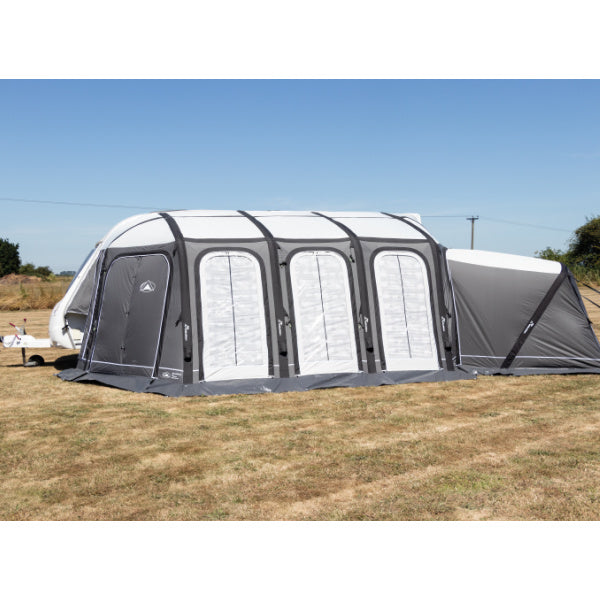 Sunncamp Esteemed Air Full Caravan Awning with white panel inserts and grey frame against blue sky