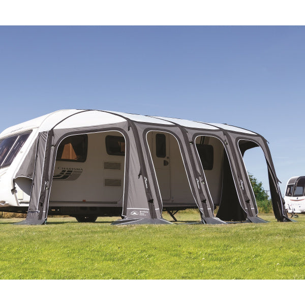 Esteemed Air Awning on grass field showing sunlit front facade and side storage area