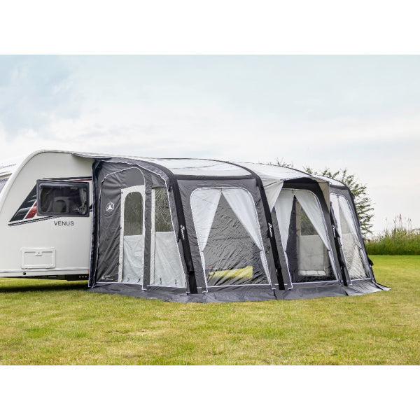 Sunncamp Inceptor Air Caravan Awning displaying side view connected to Venus caravan with grey and white panels