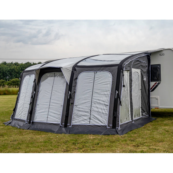 Sunncamp Inceptor Air Awning attached to caravan showing three main white panels with grey trim and structural supports