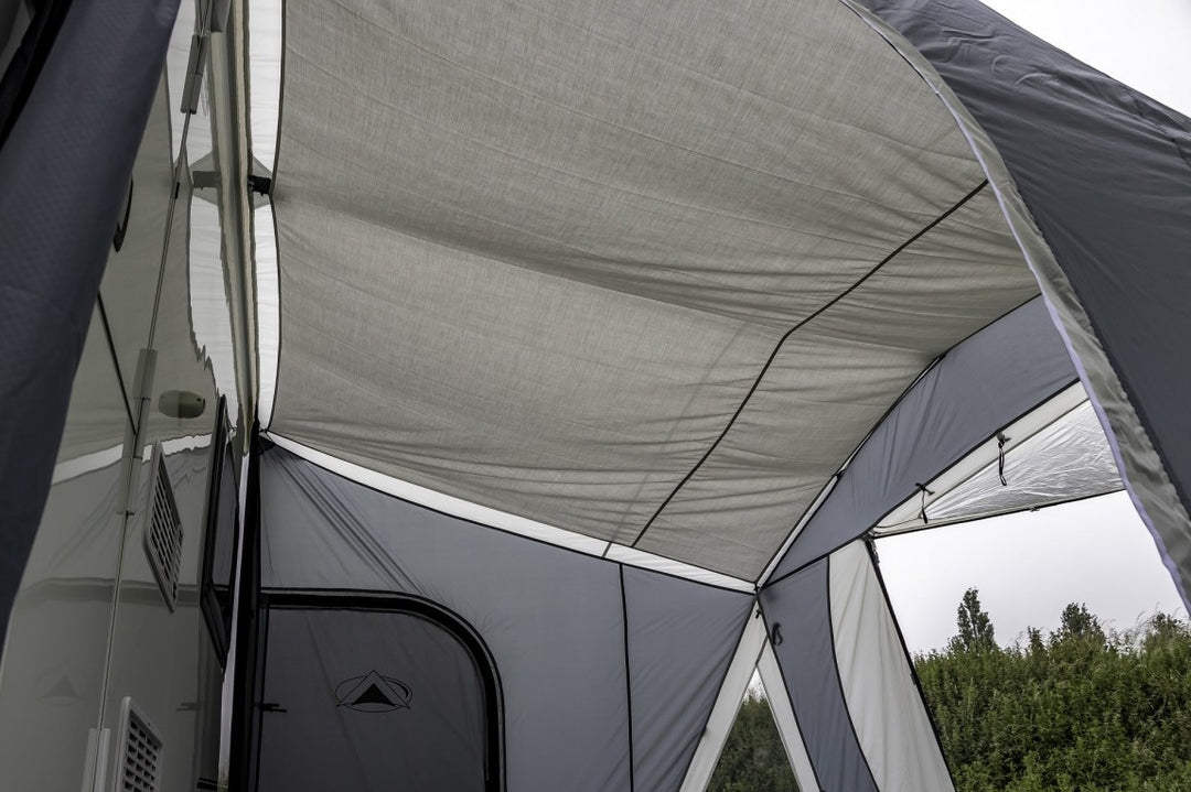 Sunncamp Icon Air Roof Lining grey roof liner installed inside an awning on a cloudy outdoor .