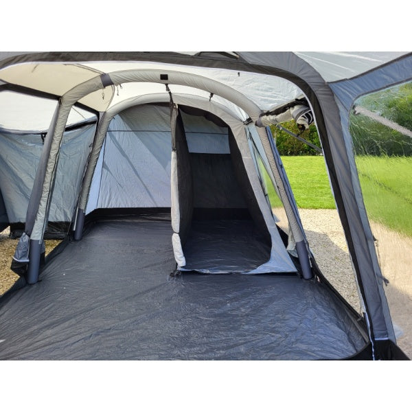 Interior view of Sunncamp Touring Motor Air focusing on bedroom compartment and groundsheet area