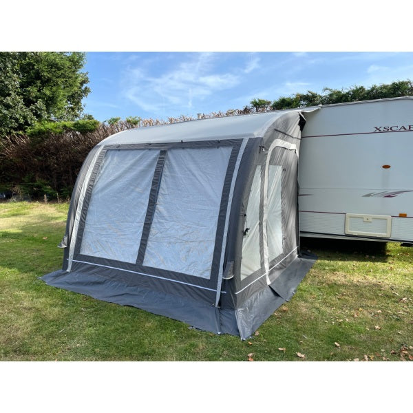 Angled view of Sunncamp Ultima 260 Air Awning showing attachment to caravan