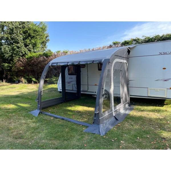 Side angle view of Sunncamp Ultima 260 Awning attached to caravan showing full extension