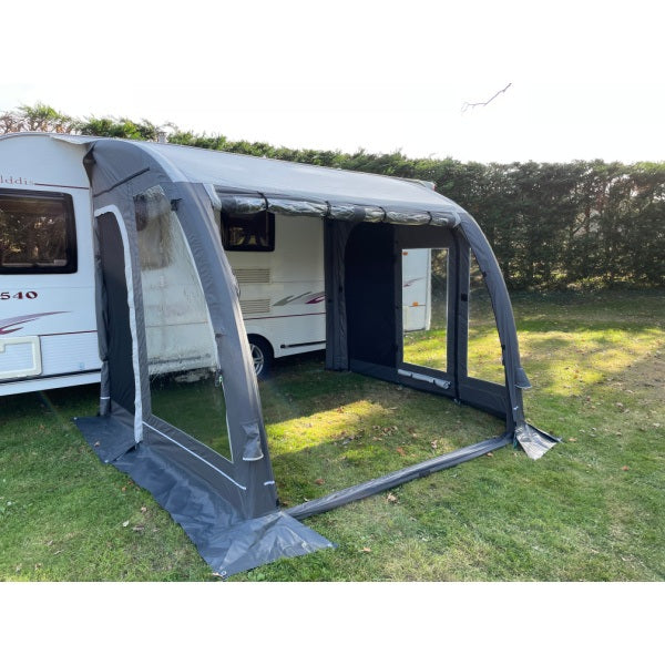 Angled perspective of Sunncamp Ultima Pro Air 260 attached to white caravan showing entrance