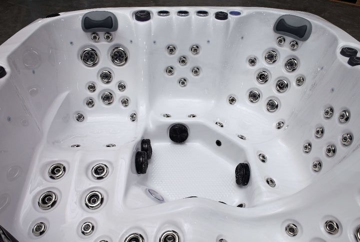 Detailed view of The Aspen Hot Tub interior featuring numerous massage jets and ergonomic seating.