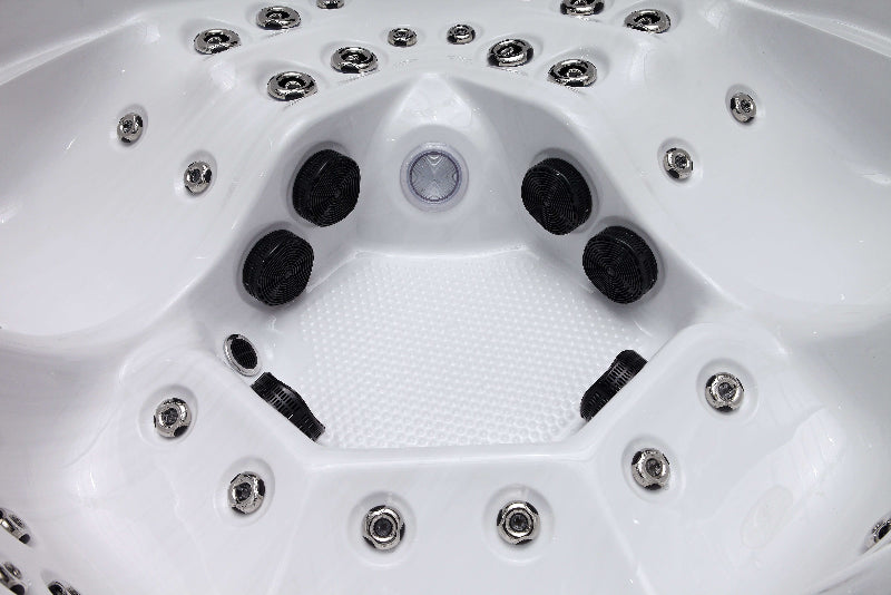 Close-up view of The Aspen Hot Tub interior showing hydrotherapy jets and textured white base.