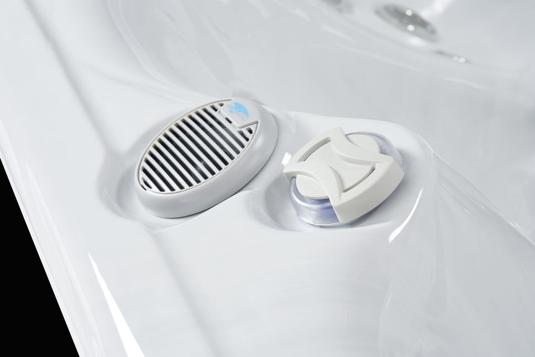 Close-up of the speaker and chemical dispenser in Luso Spas The Hydra Hot Tub on a black background.