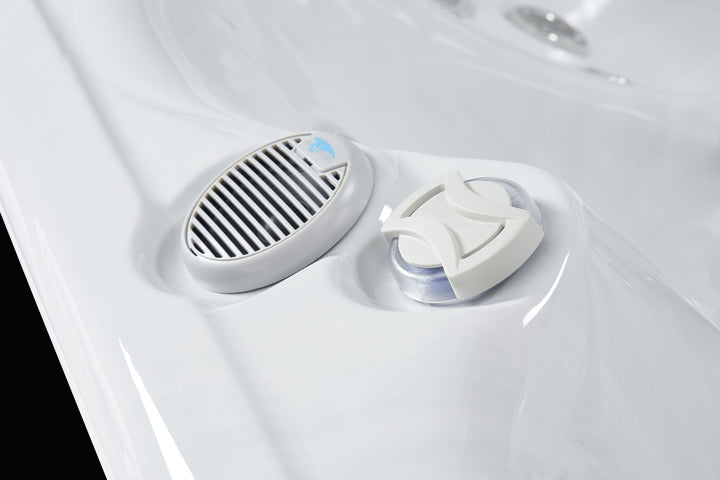 Close-up of the speaker and chemical dispenser in Luso Spas The Hydra Hot Tub on a black background.
