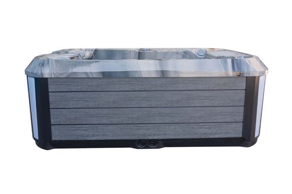 Side view of Luso Spas The Platinum 1 Hot Tub with grey wood-effect exterior panels and marble-effect acrylic shell on a white background.