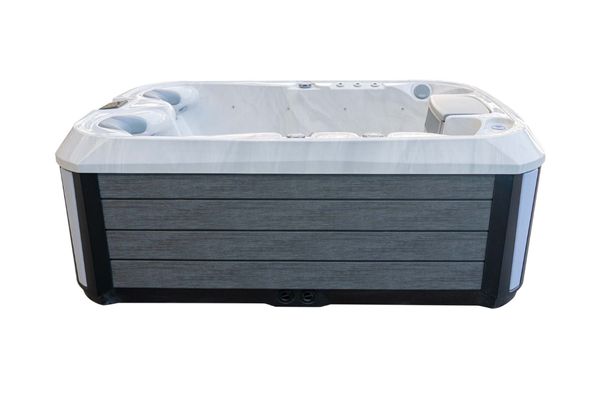 Side view of Luso Spas The Platinum 1 Hot Tub in white marble finish with sleek grey exterior panels on a white background.