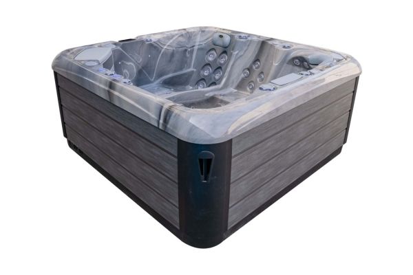 Luso Spas The Platinum 3 Hot Tub in grey marble acrylic finish, side view showing panel detail, on a white background.