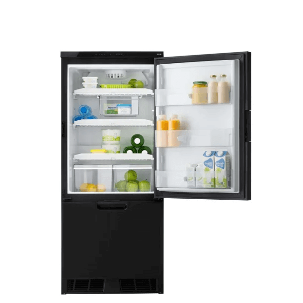 Frontal view of the Thetford T2175 12V fridge fully stocked with drinks, fruits, and dairy items, with the door wide open, on a white background.
