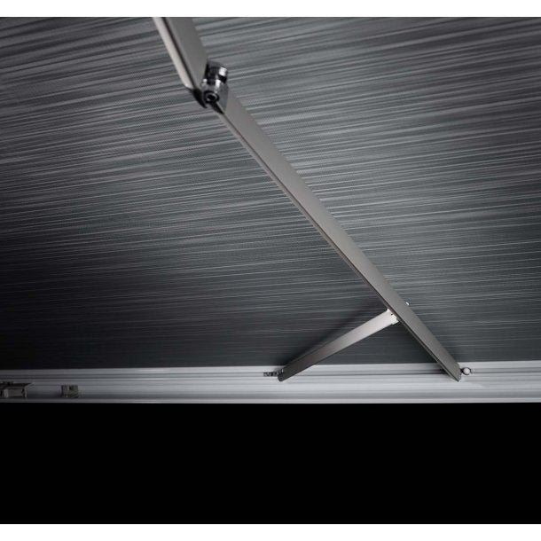 Thule awning fabric and support arms close-up on a black background.