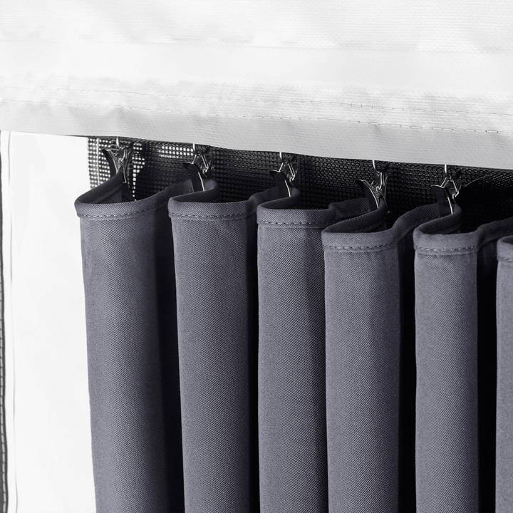 Close-up of Thule awning room curtains hanging on hooks.