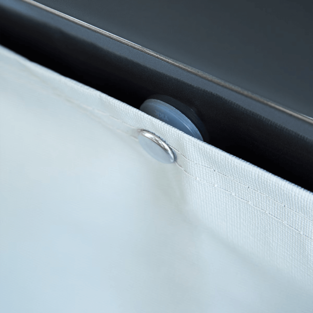 Close-up of Thule wheel cover fastener detail on a caravan wheel.