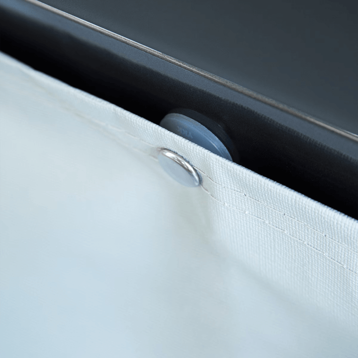 Close-up of Thule wheel cover fastener detail on a caravan wheel.