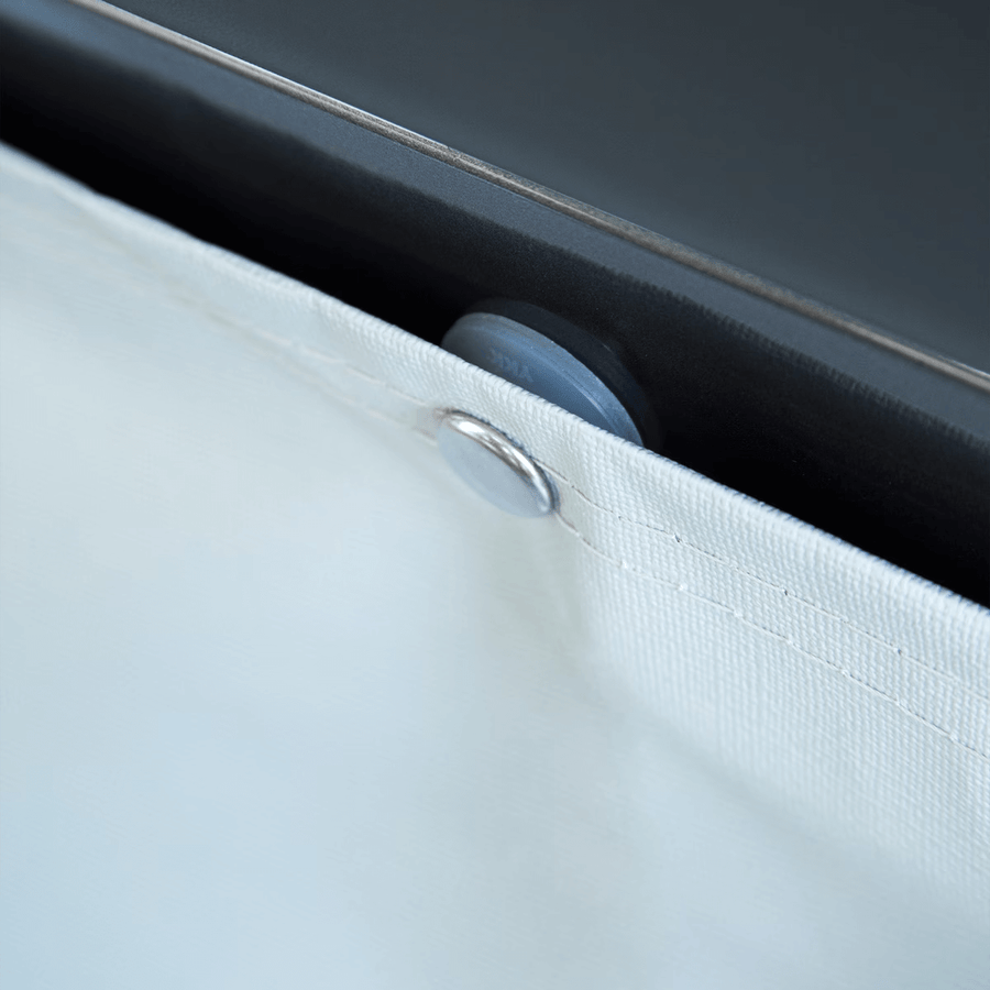 Close-up of Thule wheel cover fastener detail on a caravan wheel.