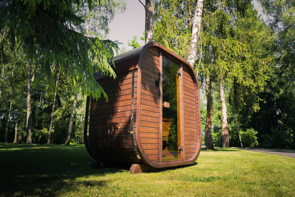 Ula Mini Outdoor Sauna interior bench showing wooden seating and panelled walls inside the sauna with natural lighting.
