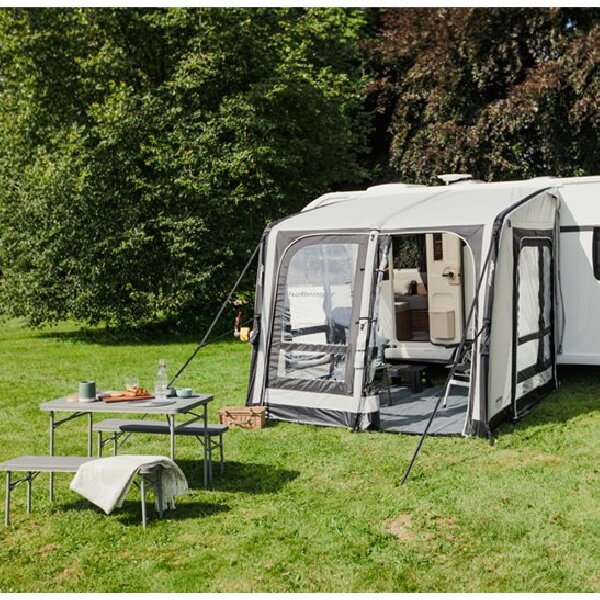 A Vango Balletto 260 in a field with a table in front of it