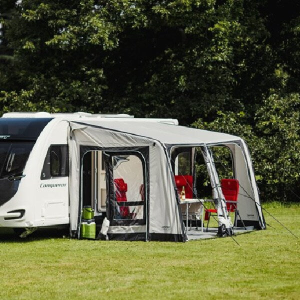 A Vango Balletto 390 Air Awning with red chairs shown from the side