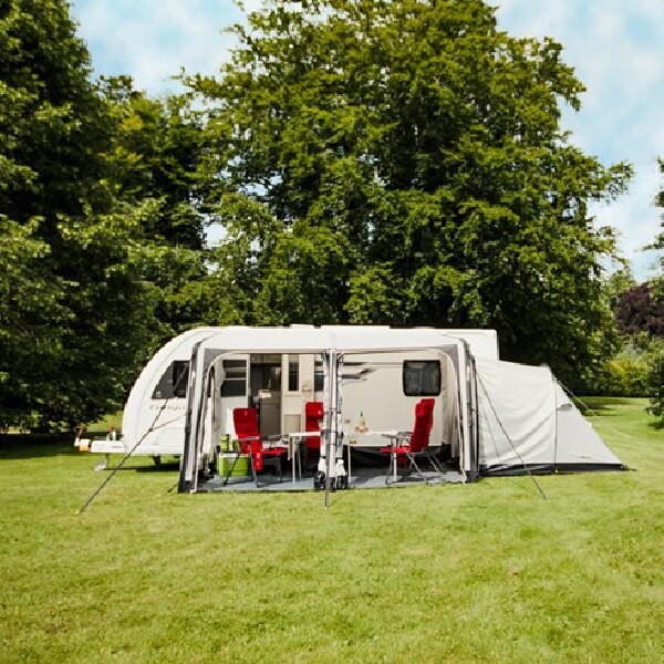 A Vango Balletto 390 Awning with no front panels and an annex