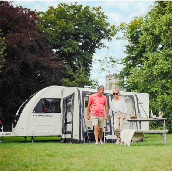 A Vango Balletto Air 260 with a couple stood in front in a field