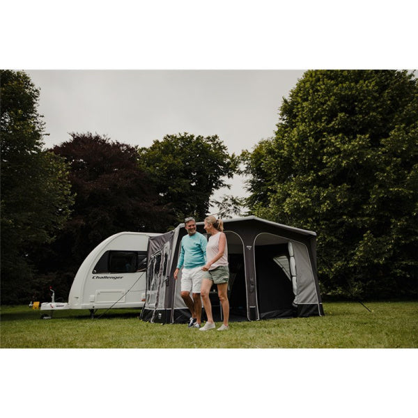 A Vango Riviera 390 with a couple standing in front of it