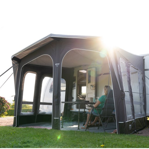 A Vango Riviera Air 330 with open panels and a woman sitting inside