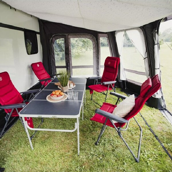 Inside of a Vango Tuscany 400 with red chairs 