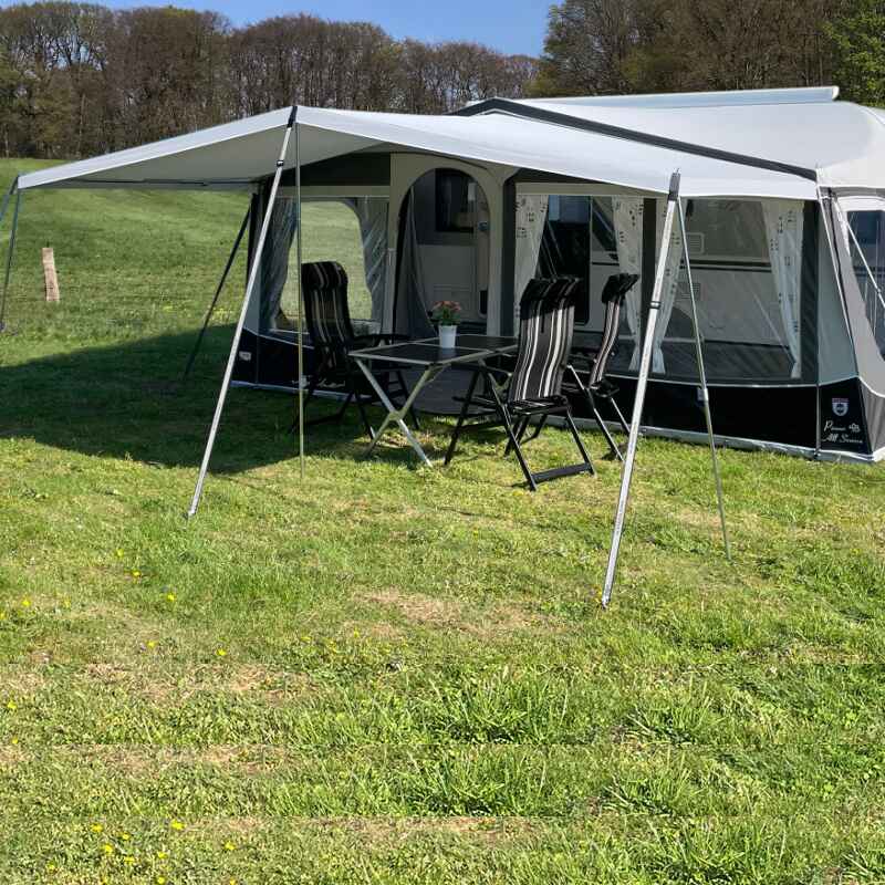 A Walker Castel Sun Canopy in a field 