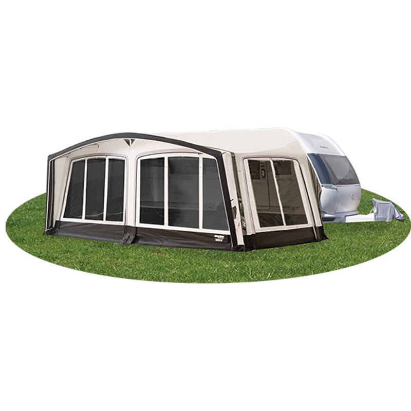 Caravan with an attached westfield pluto 2air Awning on a grassy area