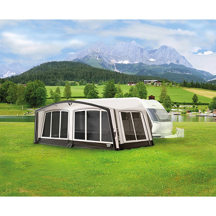 Westfield Pluto 2 awning with an attached awning in a scenic outdoor setting with mountains and greenery.