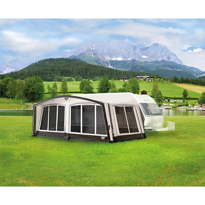 Westfield Pluto 2 awning with an attached awning in a scenic outdoor setting with mountains and greenery.