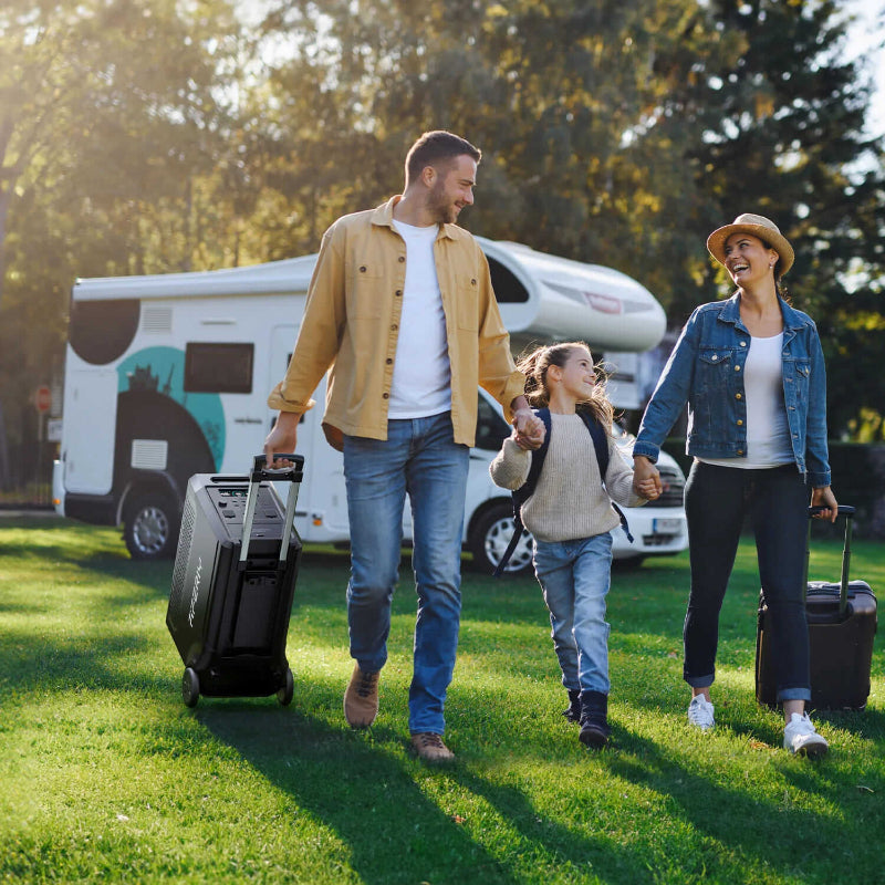 Family walking outdoors with luggage and the Aferiy P310 generator being rolled behind them, RV in the background.