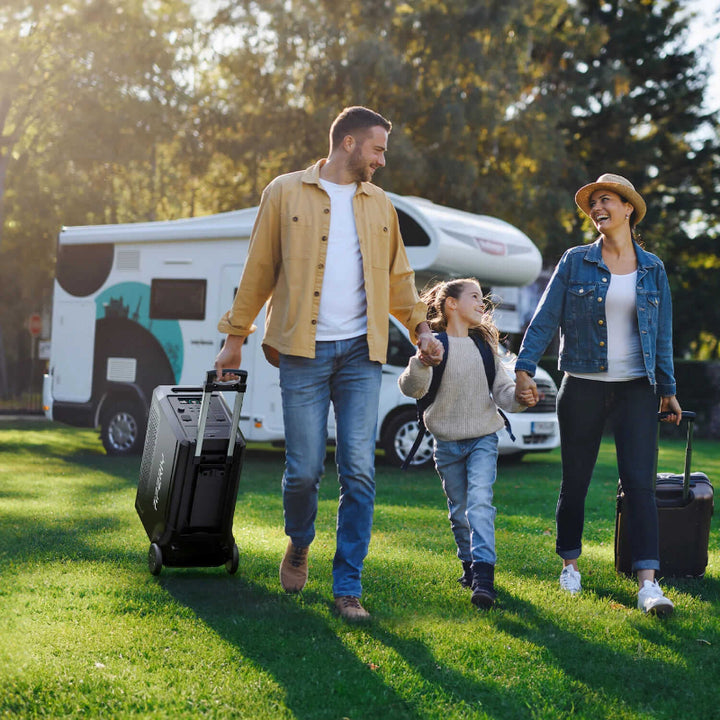 Family walking outdoors with luggage and the Aferiy P310 generator being rolled behind them, RV in the background.