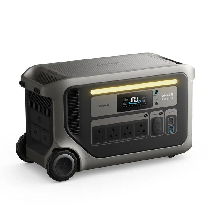 Anker SOLIX F3000 Portable Power Station front three-quarter view displaying its digital screen, multiple power outlets, LED light bar and wheeled design on a white background.